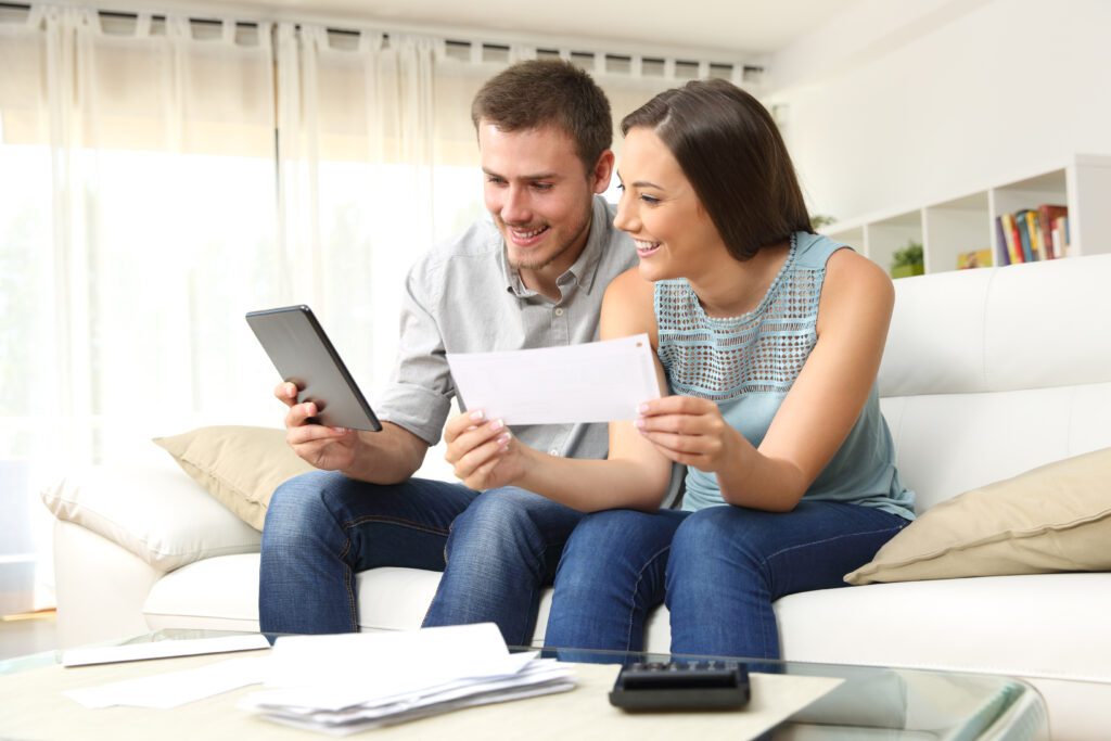 Couple holding paycheck Promote music education. Earn money.