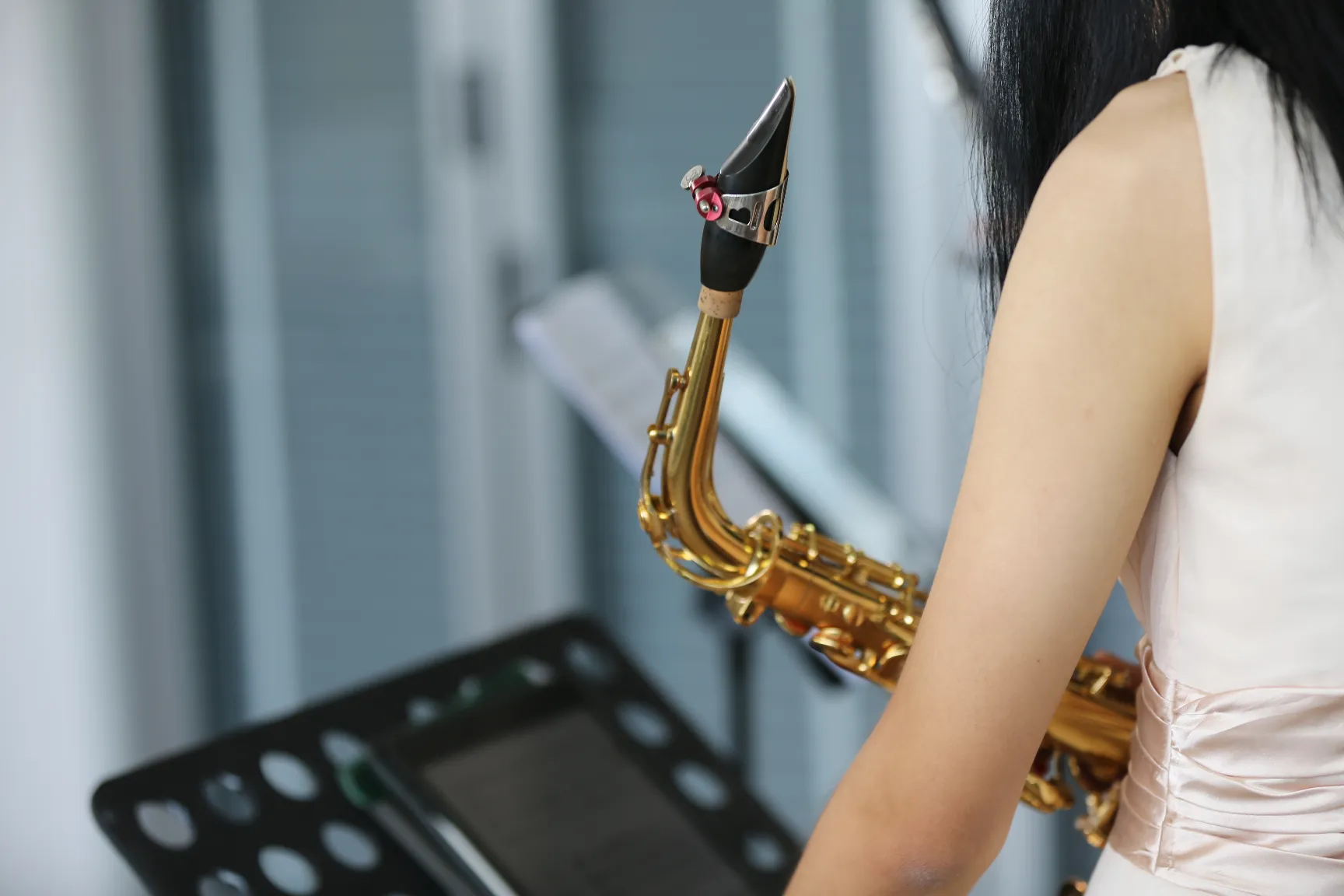 2. A student using a practice chart while playing an instrument Student using a practice chart