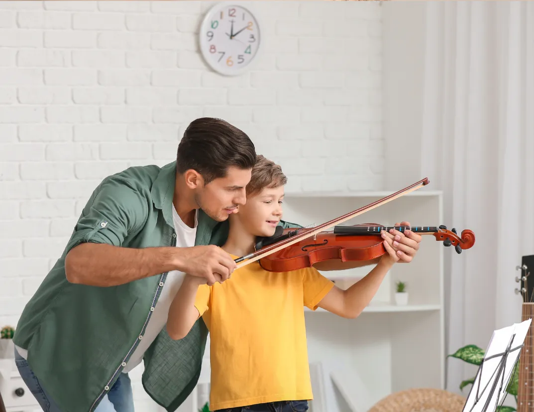 image of a homeschooling parent aiding their child during an online music lesson, showing the supportive and engaging learning environment.1 parent helping child with music lessons