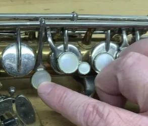 saxophone pad replacement process, instrument repair